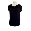Black sleeveless top on a mannequin against a white background