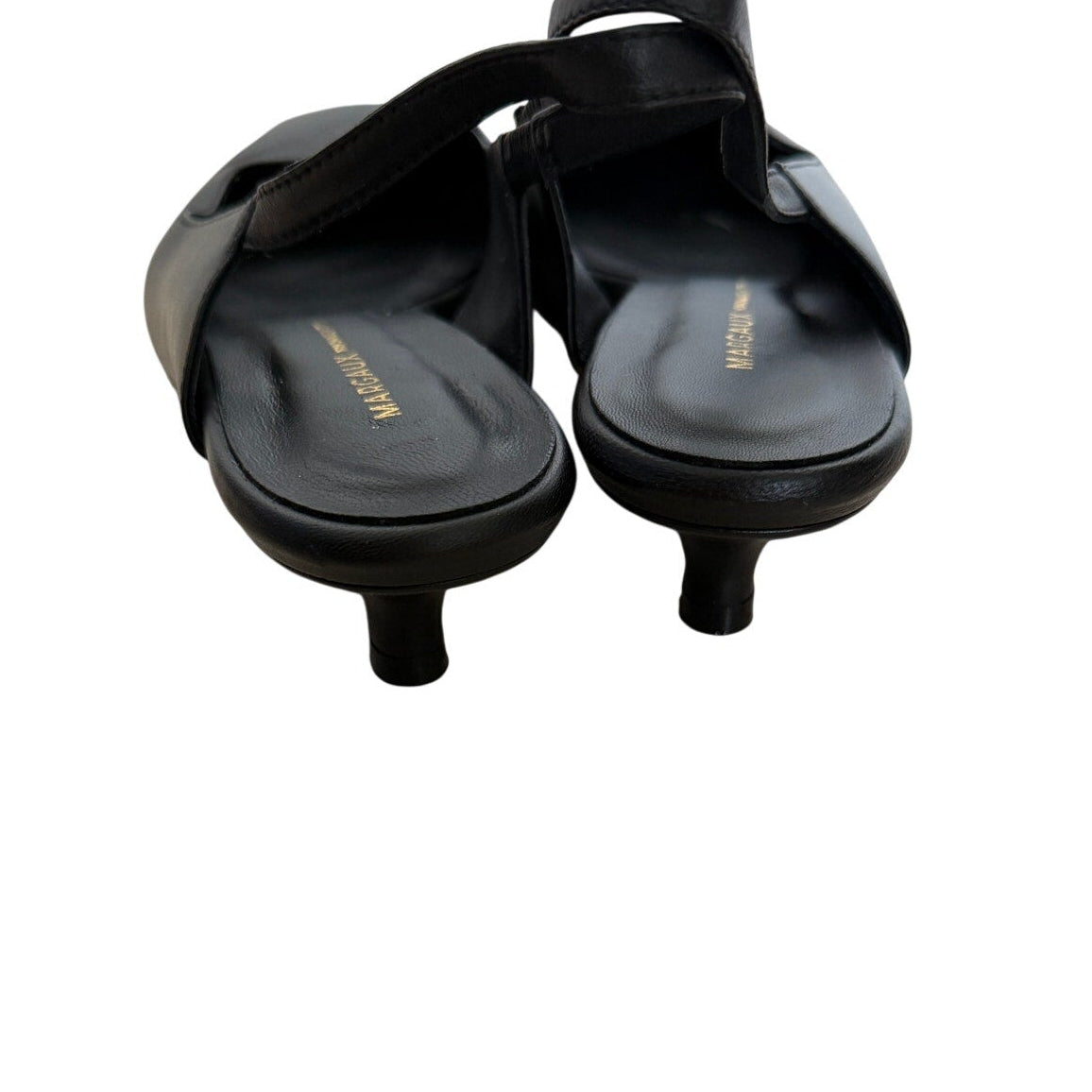 A pair of black Margaux leather high-heel slide sandals with crisscrossing straps, shown from a top-down view on a plain white background.